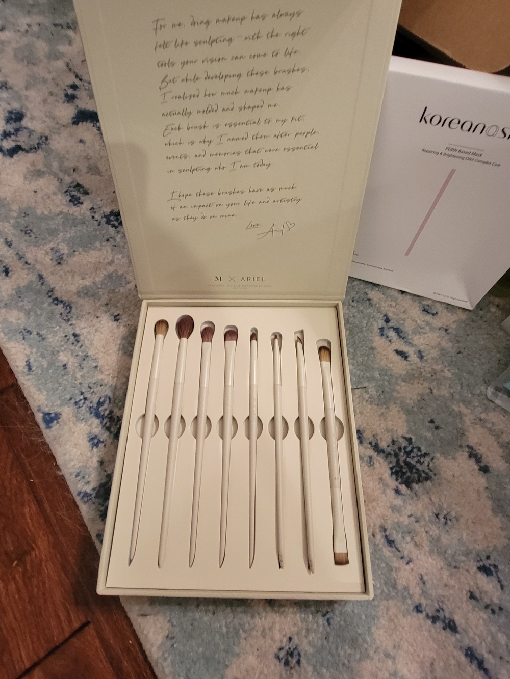 A Box Full Of Many High End Facial Items & Women's 8 Piece White Makeup Brushes